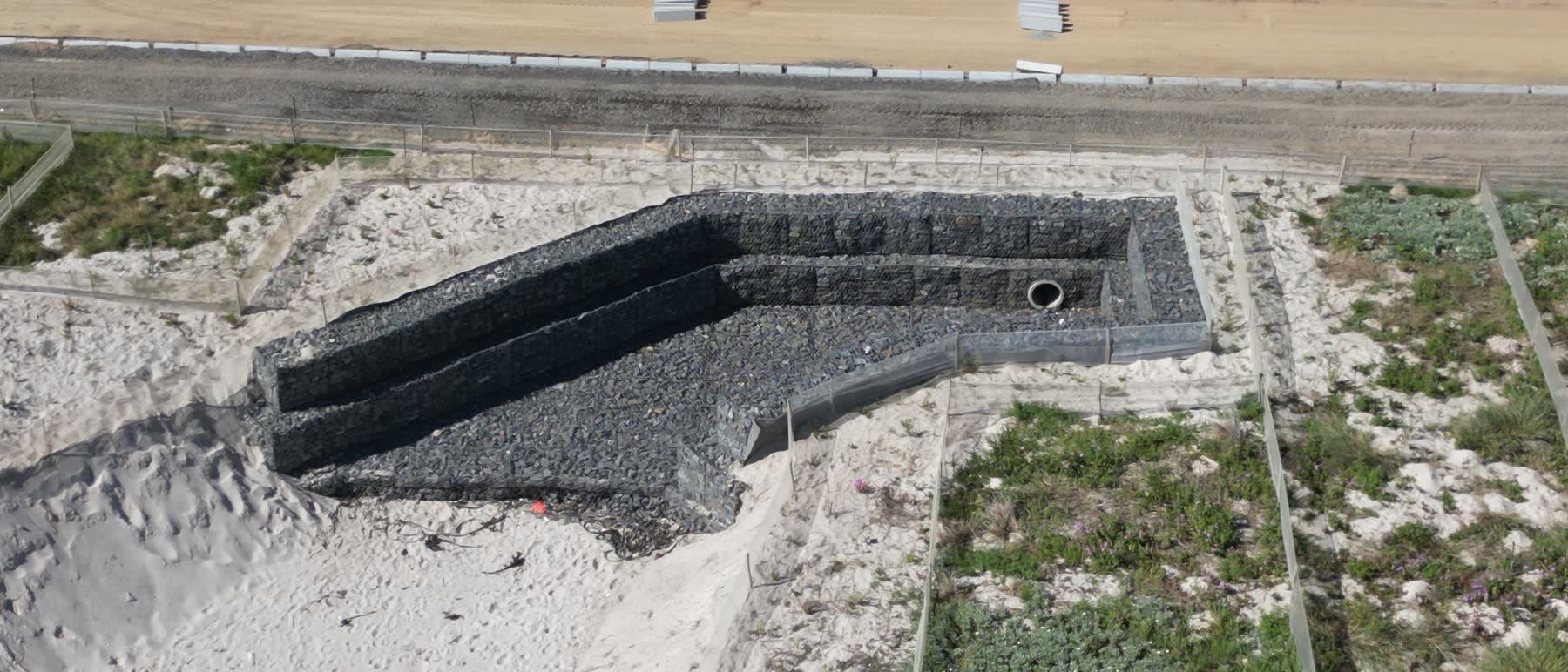 Gabion stormwater outfall structure on the Blaauwberg beachfront, seen from above