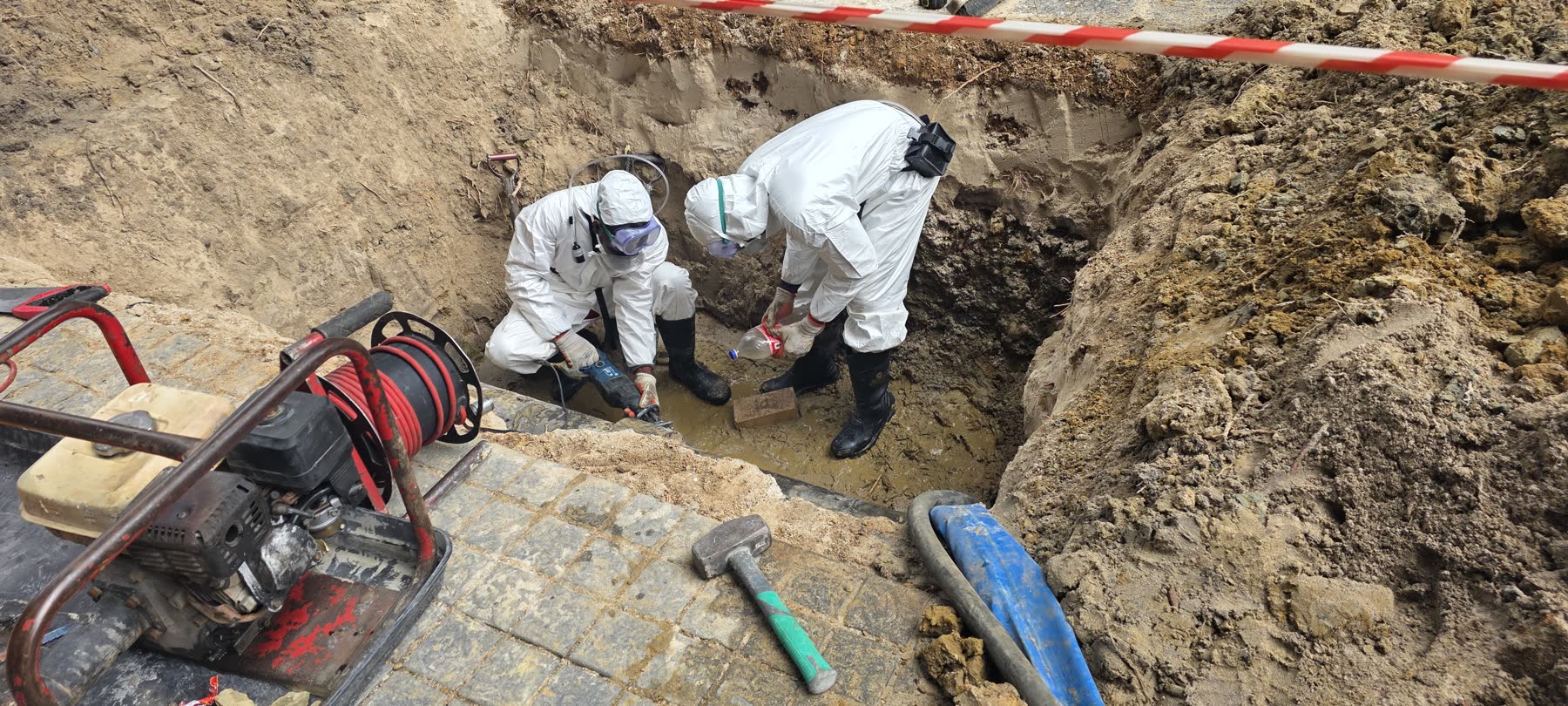 FN Building Projects crew in full protective equipment working in a controlled excavation