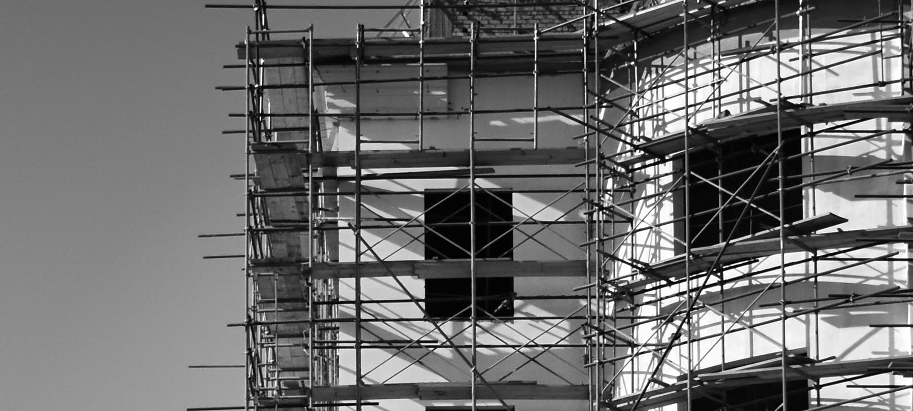 Scaffolding on an FN Building Projects site, in black and white