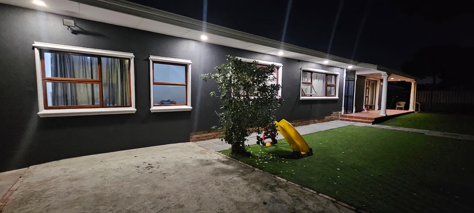 A completed FN Building Projects home renovation at Townsend Estate, lit at night