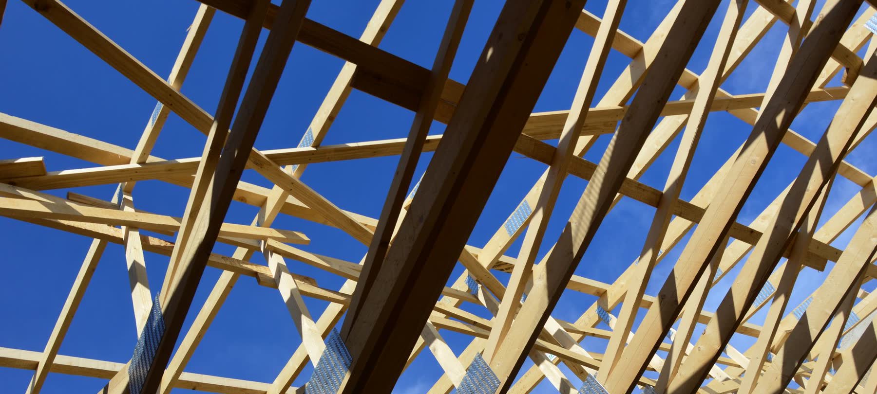 Timber roof trusses of a house under construction